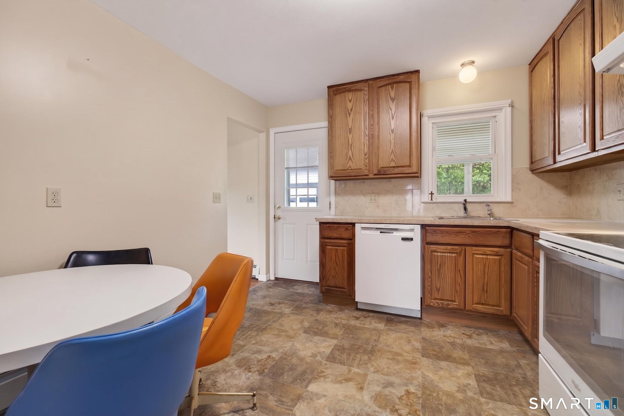 121 Cherry Hill Road Middlefield, CT 06455 - Photo 5 of 40 a kitchen with stainless steel appliances granite countertop a sink a stove a refrigerator cabinets and a window