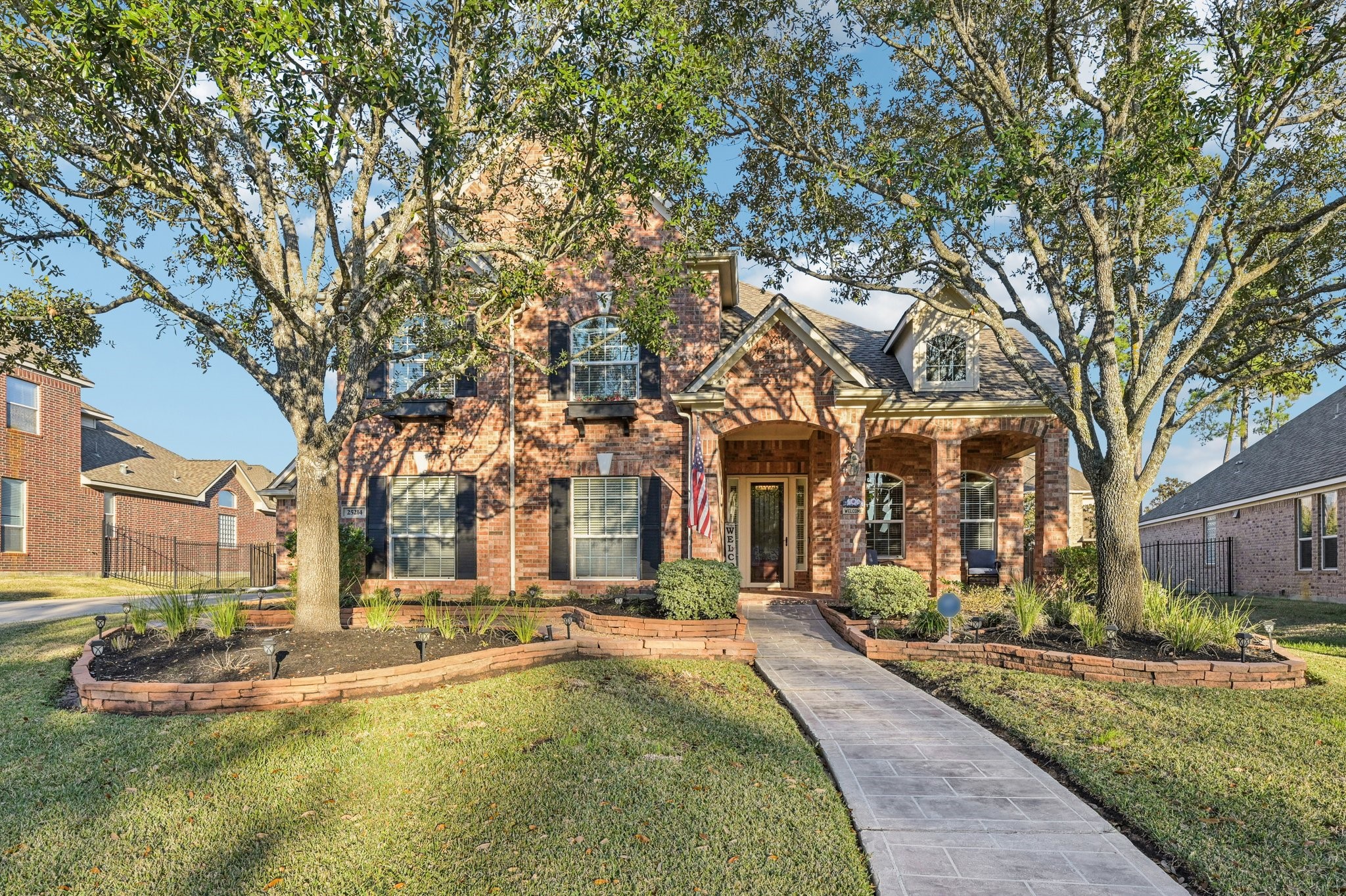 25214 East Titan Springs Drive Spring, TX 77389 - Photo 2 of 44 a view of a building with a yard