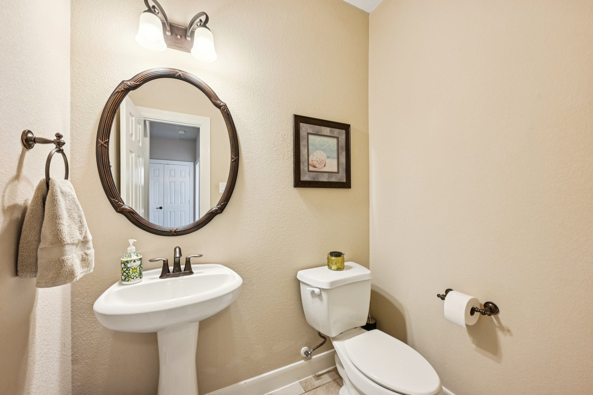 25214 East Titan Springs Drive Spring, TX 77389 - Photo 23 of 44 a bathroom with a toilet sink and mirror