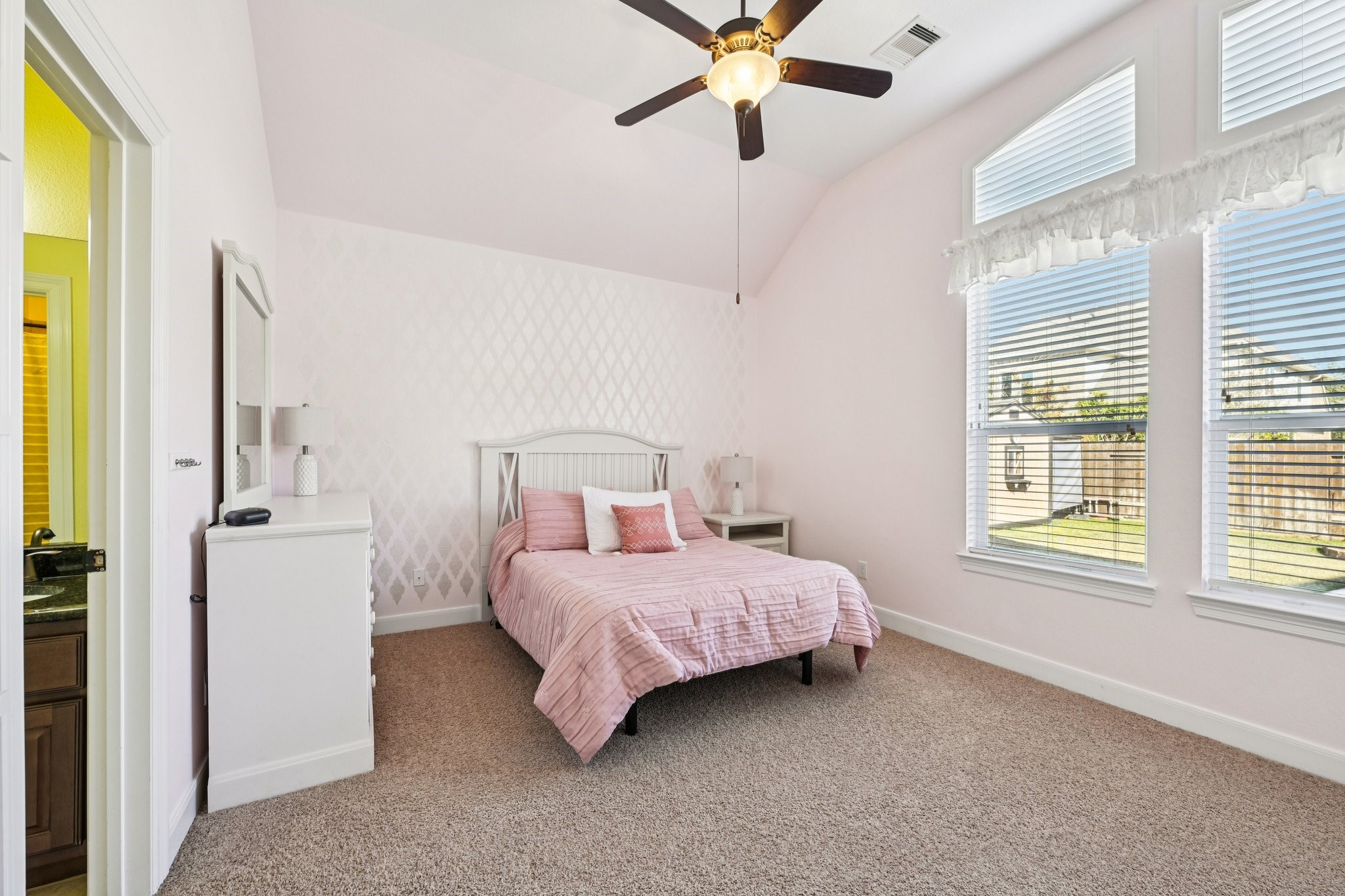 25214 East Titan Springs Drive Spring, TX 77389 - Photo 30 of 44 a bedroom with a bed and a window