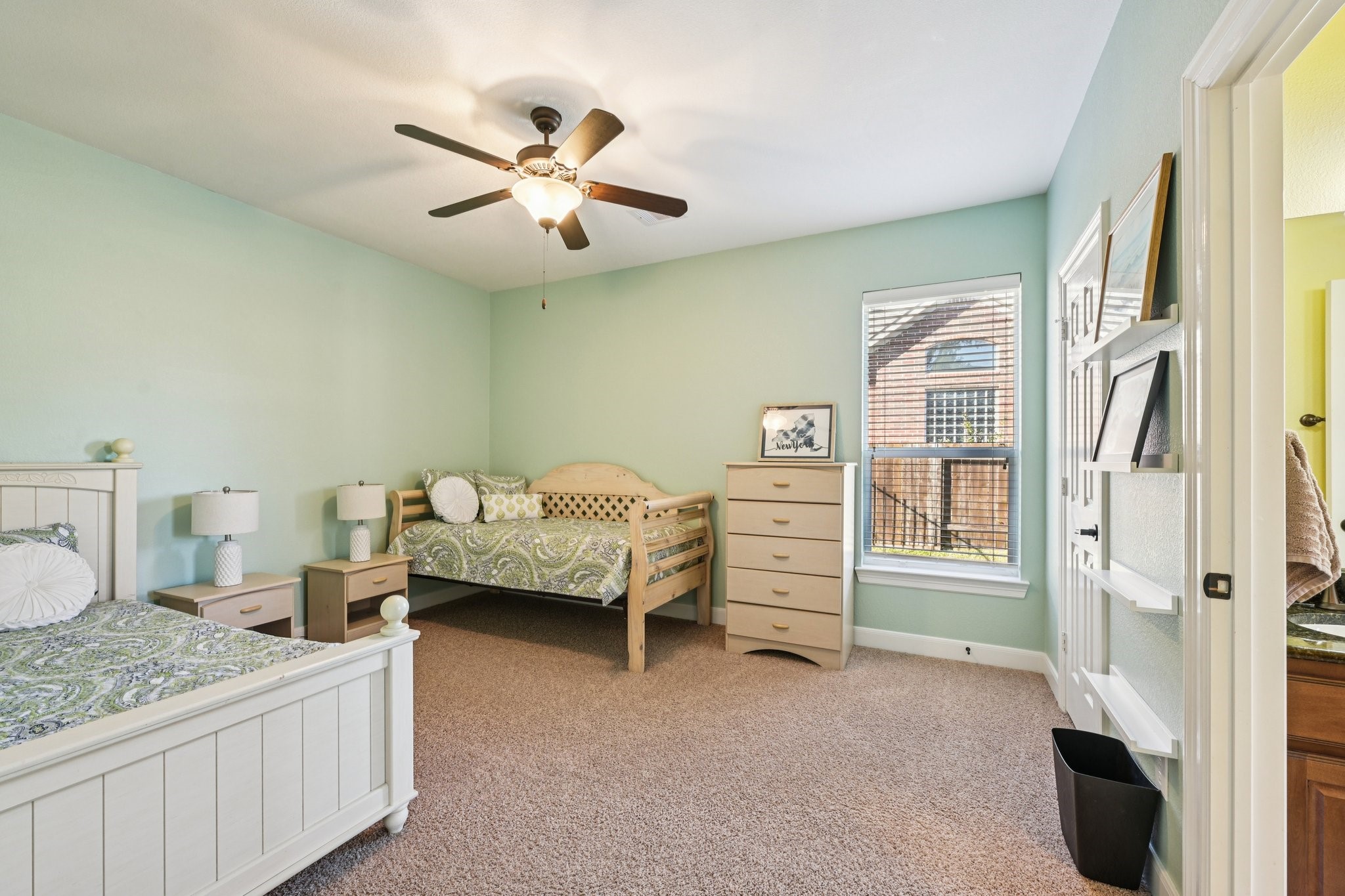 25214 East Titan Springs Drive Spring, TX 77389 - Photo 32 of 44 a bedroom with a bed and a chandelier