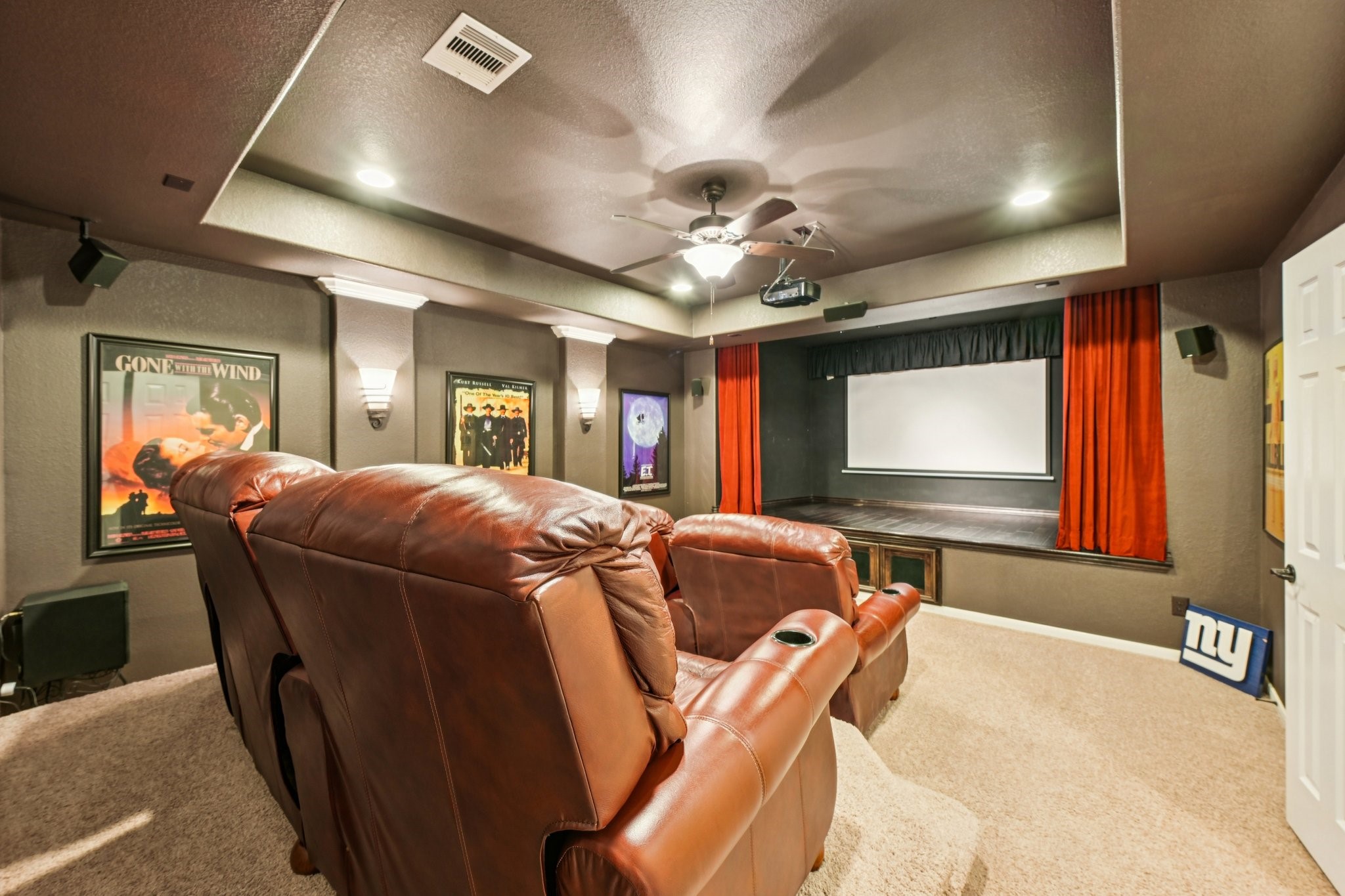 25214 East Titan Springs Drive Spring, TX 77389 - Photo 38 of 44 a living room with furniture a flat screen tv and a large window