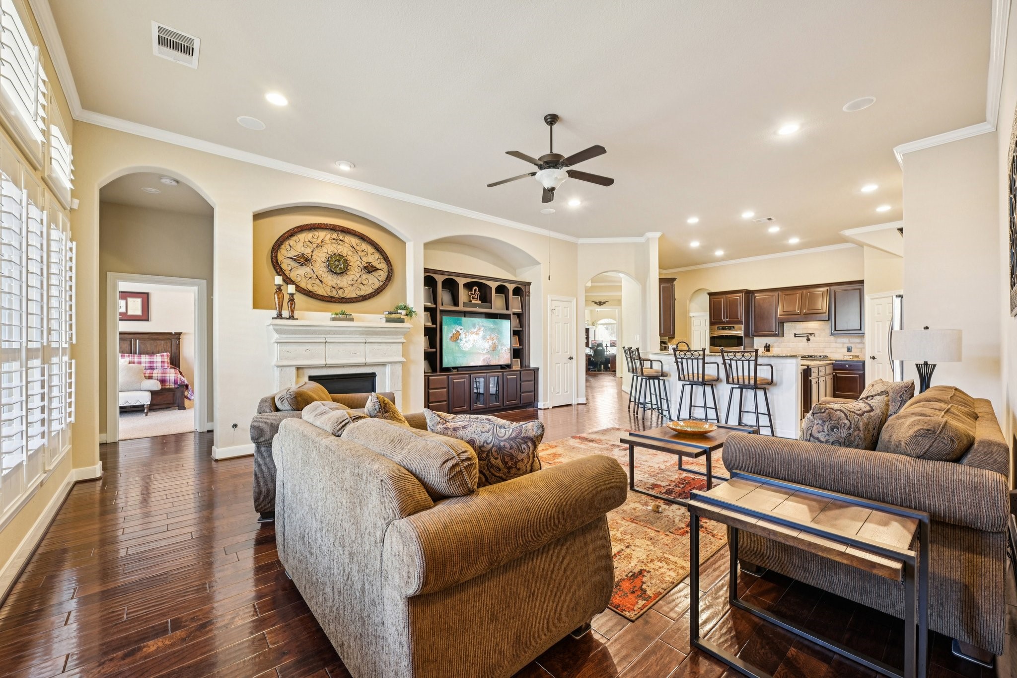 25214 East Titan Springs Drive Spring, TX 77389 - Photo 9 of 44 a living room with furniture and kitchen view