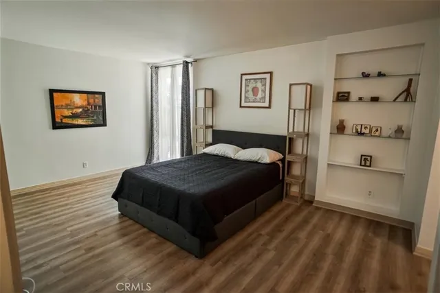 a bedroom with a bed and closet