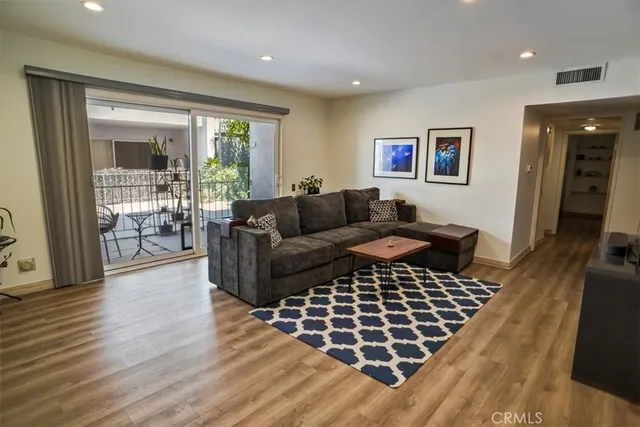 a living room with furniture and a rug