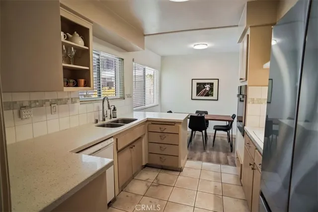 a kitchen with sink cabinets and window