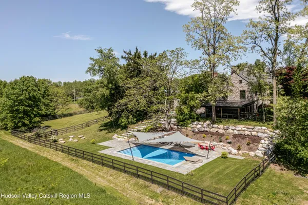 a view of a backyard with plants and a patio