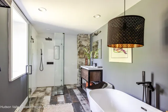 a bedroom with bed and a window