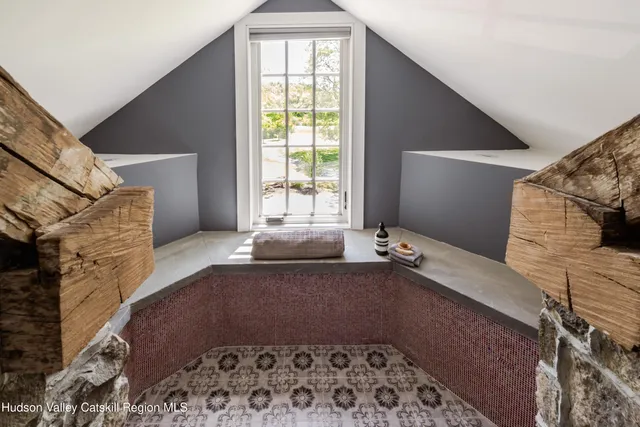 an aerial view of a house with a lake view