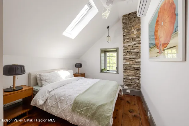 an aerial view of residential house with outdoor space and trees all around