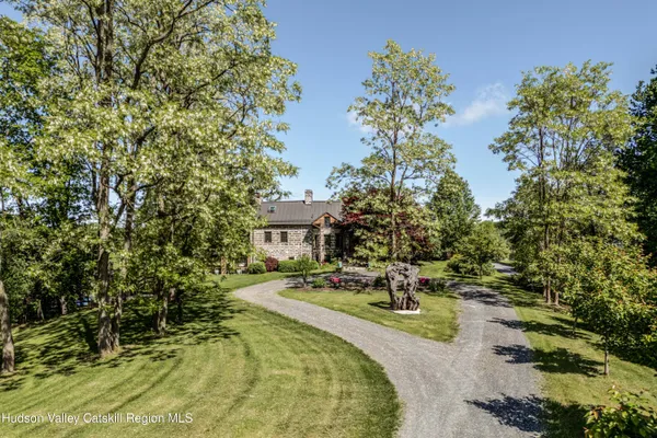 a view of bathroom with a shower and a sink