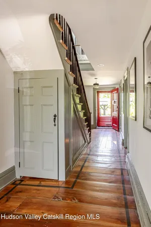 a view of a dining room with furniture wooden floor and a chandelier