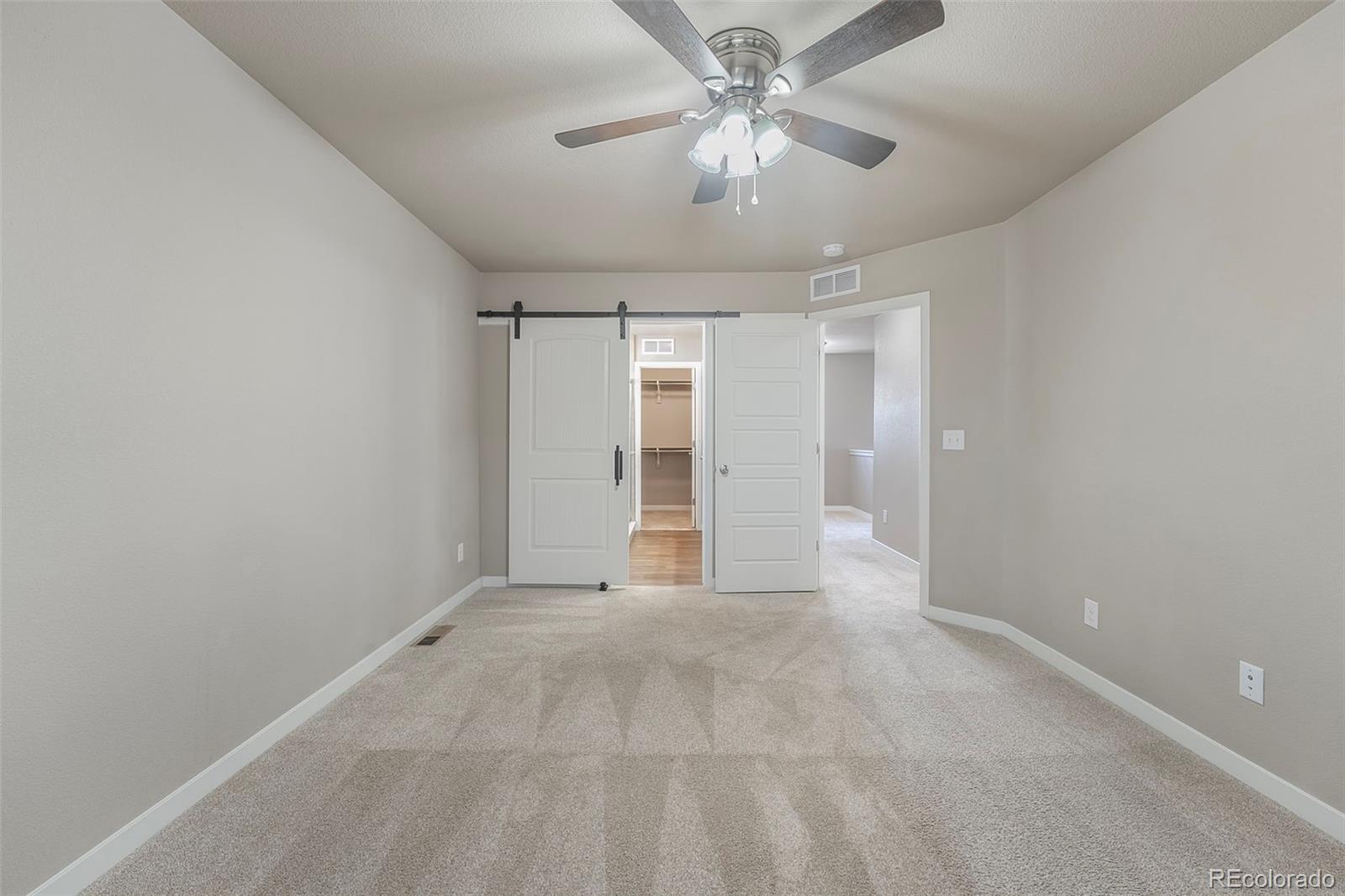 9528 Timberlake Loop Colorado Springs, CO 80927 - Photo 18 of 37 a view of an empty room with a window
