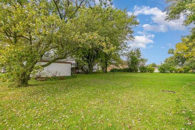 a fire hydrant in the middle of a field