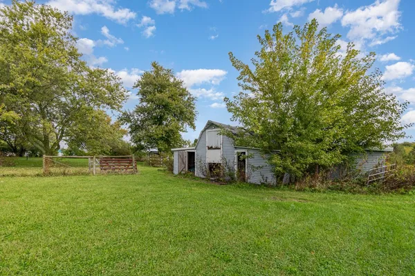 a view of a house with a big yard