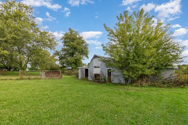 a view of a house with a big yard