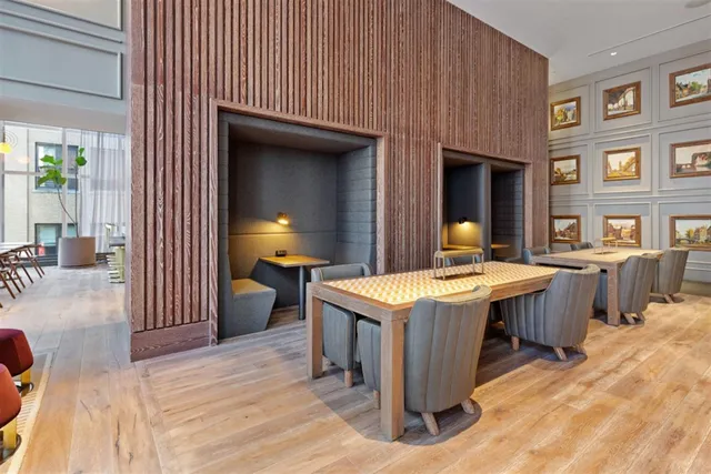 a kitchen that has a table and chairs in it