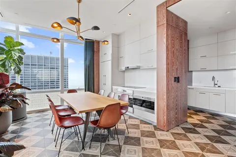 a dining room with a table and chairs