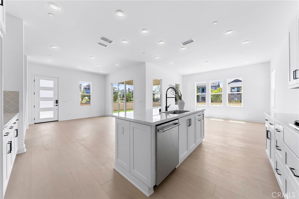 123 Bosal Irvine, CA 92618 - Photo 21 of 75 a kitchen with stainless steel appliances granite countertop a stove and a sink