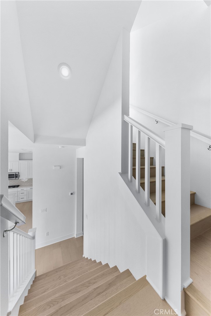 123 Bosal Irvine, CA 92618 - Photo 28 of 75 a view of an empty room with wooden floor and a window