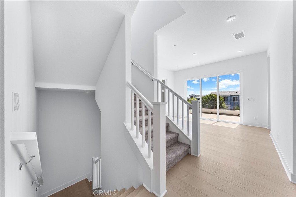 123 Bosal Irvine, CA 92618 - Photo 29 of 75 a view of staircase with white walls and a next to a window
