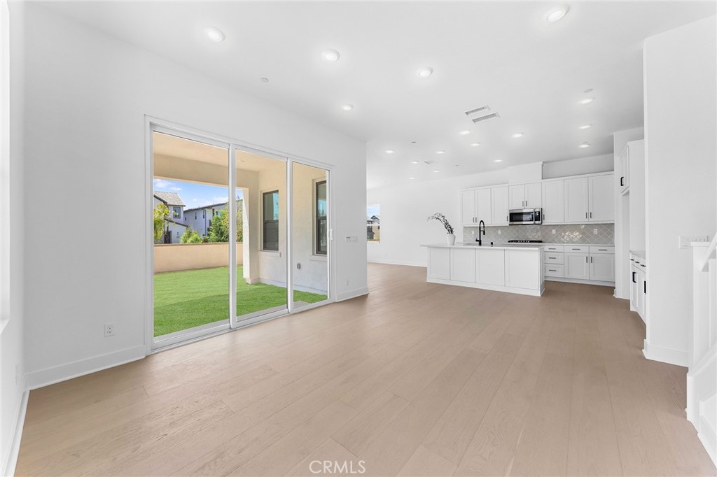 123 Bosal Irvine, CA 92618 - Photo 10 of 75 a view of large kitchen with white cabinets and stainless steel appliances