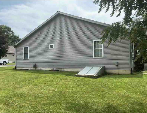 302 South Walnut Street Colfax, IL 61728 - Photo 24 of 25 a view of a backyard with a garden