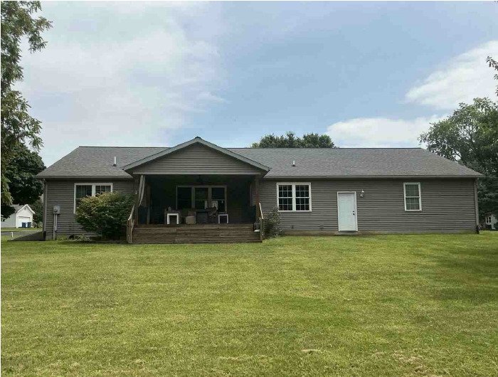 302 South Walnut Street Colfax, IL 61728 - Photo 25 of 25 a front view of a house with a garden