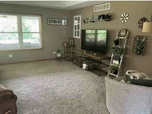 a room with furniture and a flat screen tv