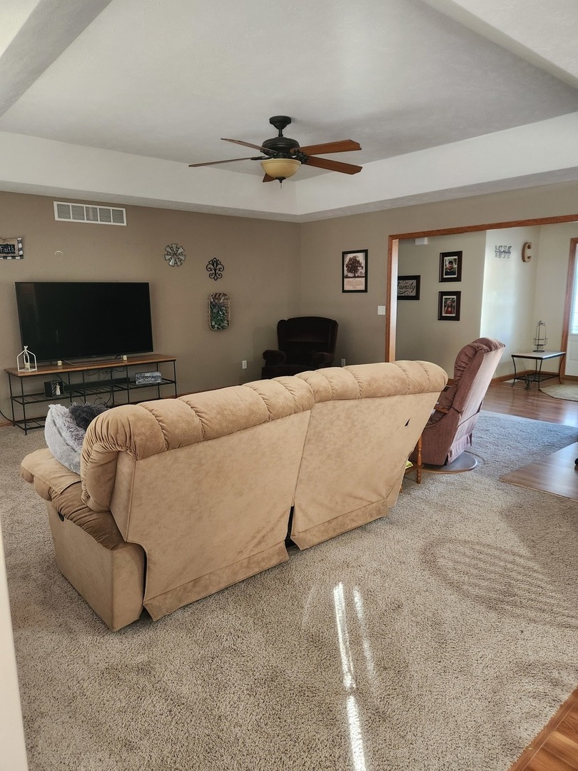 302 South Walnut Street Colfax, IL 61728 - Photo 7 of 25 a bedroom with a bed and a flat screen tv