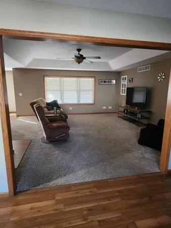 a living room with furniture flat screen tv and a fireplace