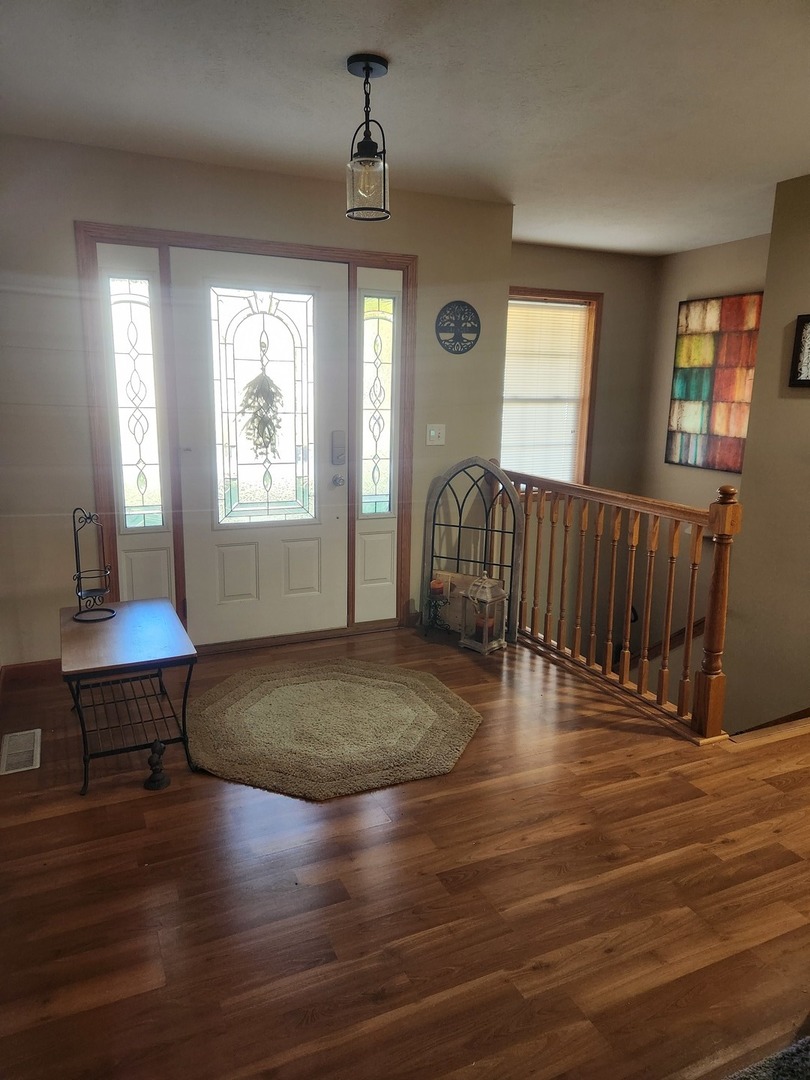 302 South Walnut Street Colfax, IL 61728 - Photo 9 of 25 a view of livingroom with furniture wooden floor and window