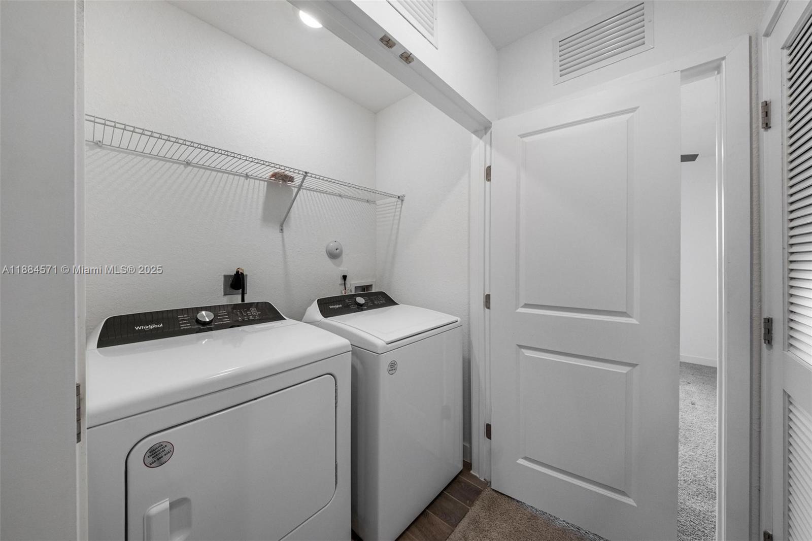 186 Southeast 5th Court, Unit 186 Deerfield Beach, FL 33441 - Photo 7 of 10 a utility room with dryer and washer