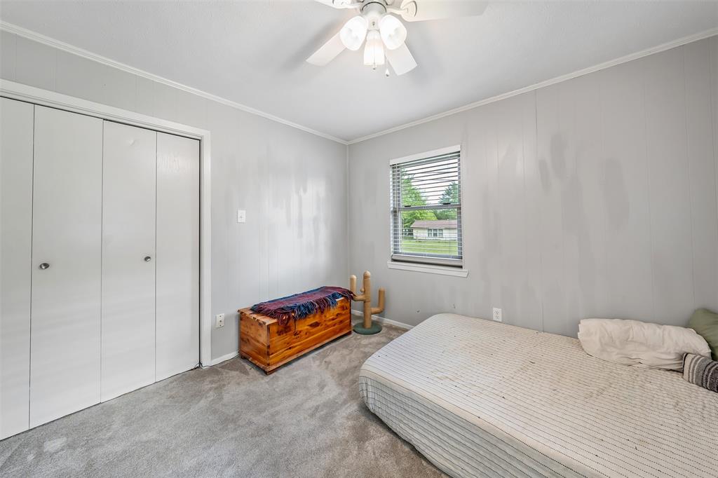 621 Athens Street Canton, TX 75103 - Photo 15 of 25 a bedroom with a bed and a window