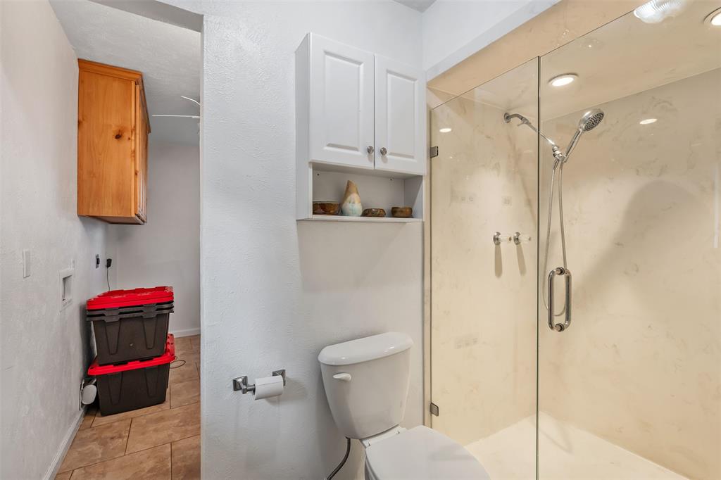 621 Athens Street Canton, TX 75103 - Photo 16 of 25 a bathroom with a shower and a toilet