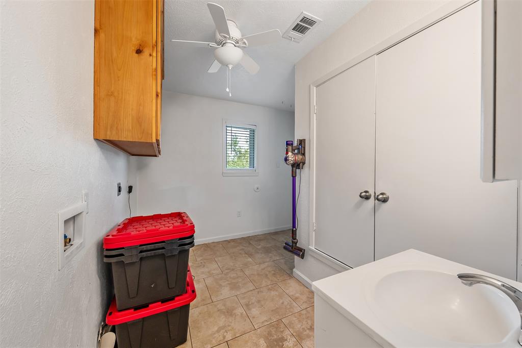 621 Athens Street Canton, TX 75103 - Photo 18 of 25 a bedroom with a bed and a dresser