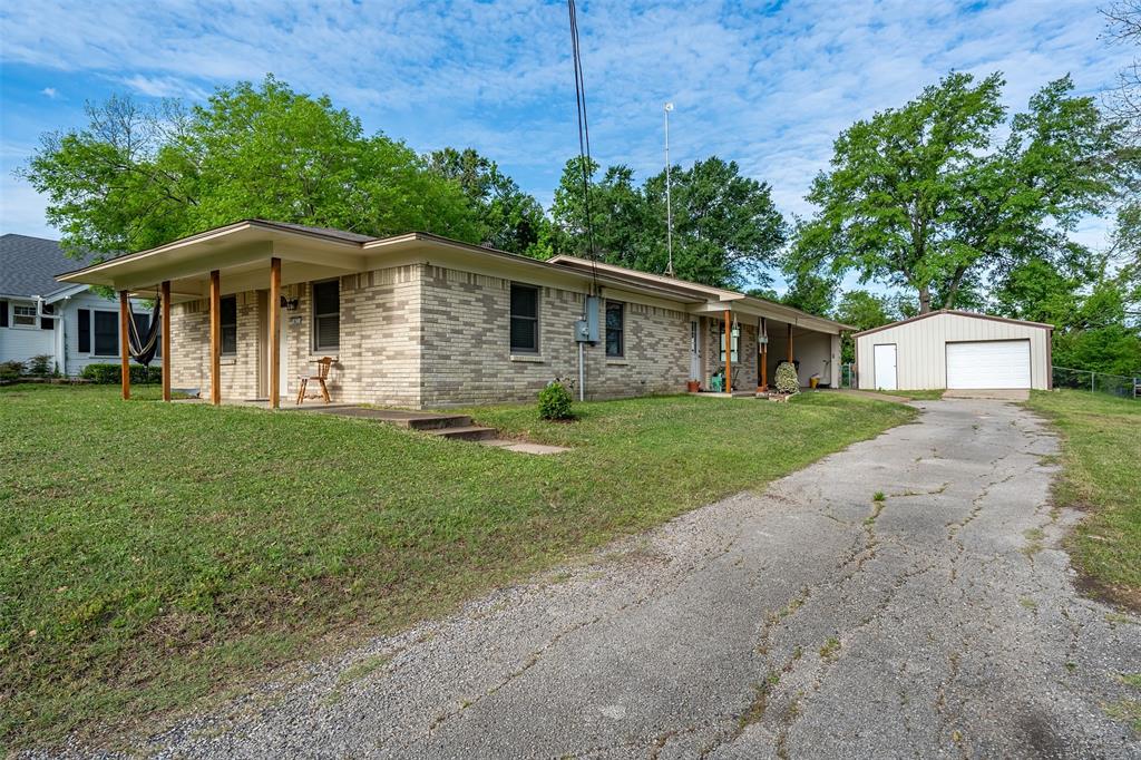 621 Athens Street Canton, TX 75103 - Photo 21 of 25 a front view of a house with a yard