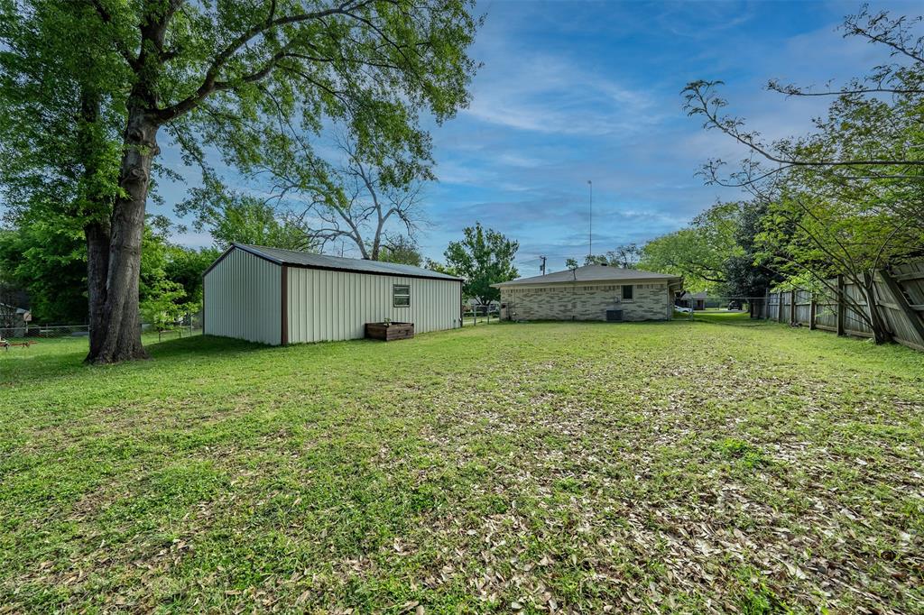 621 Athens Street Canton, TX 75103 - Photo 23 of 25 a view of a backyard with a garden