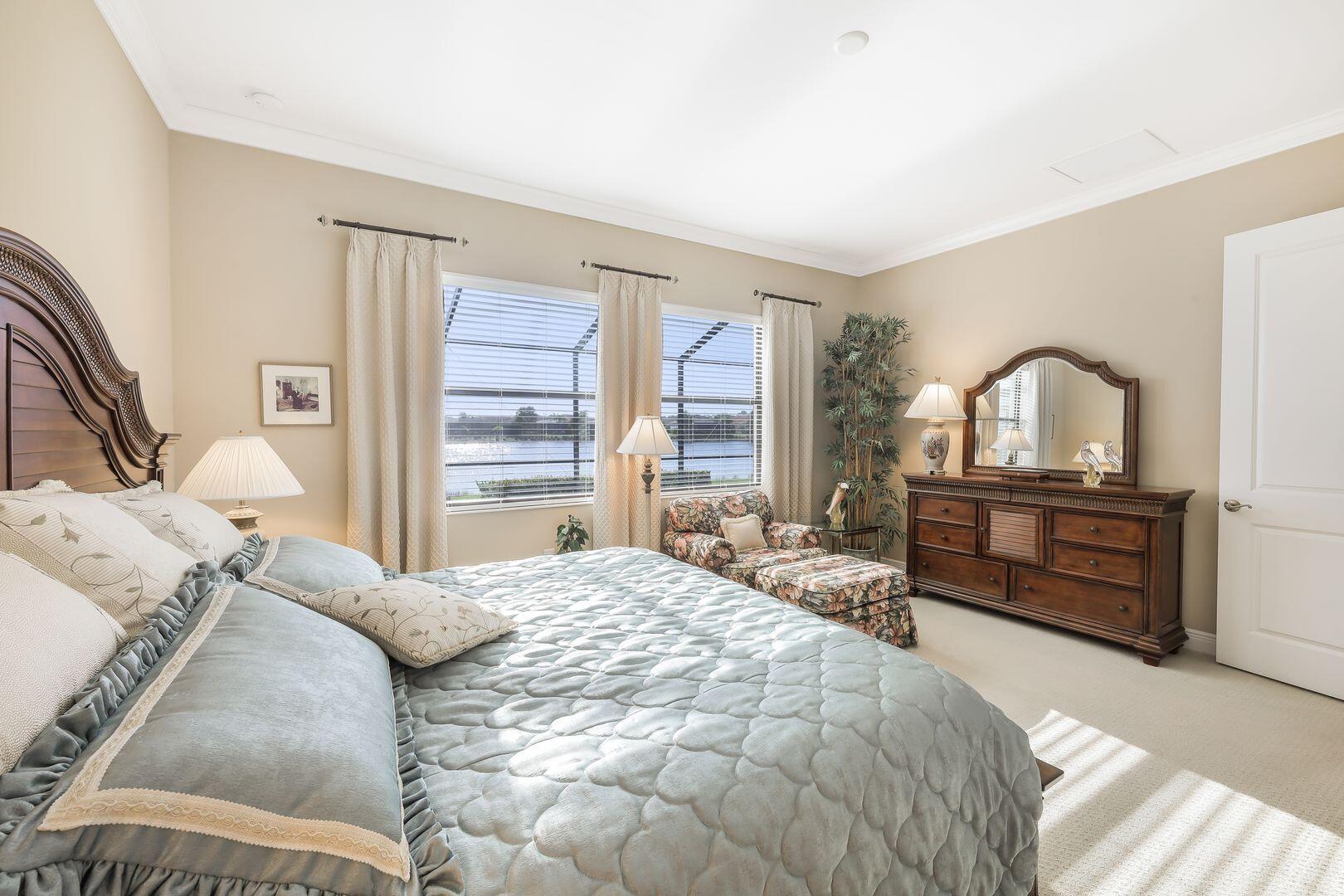 1433 Redona Way Naples, FL 34113 - Photo 15 of 50 a bedroom with a bed and a large window with the outer view