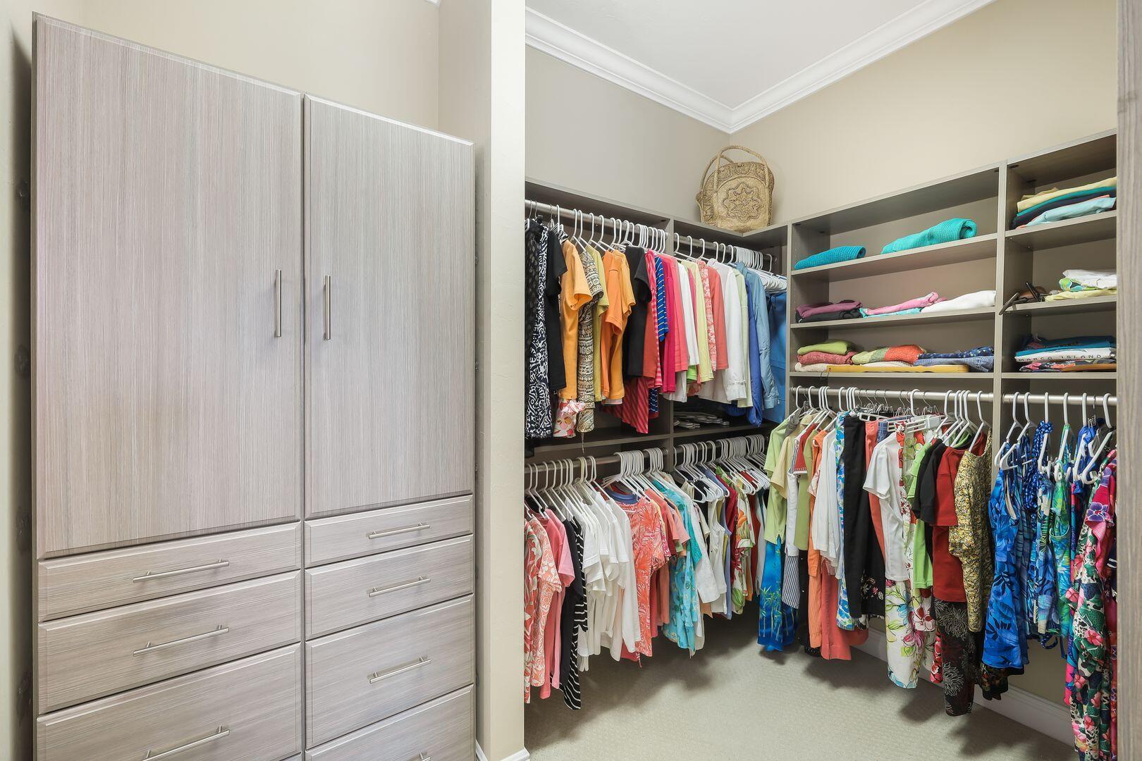 1433 Redona Way Naples, FL 34113 - Photo 18 of 50 a view of walk in closet with clothes