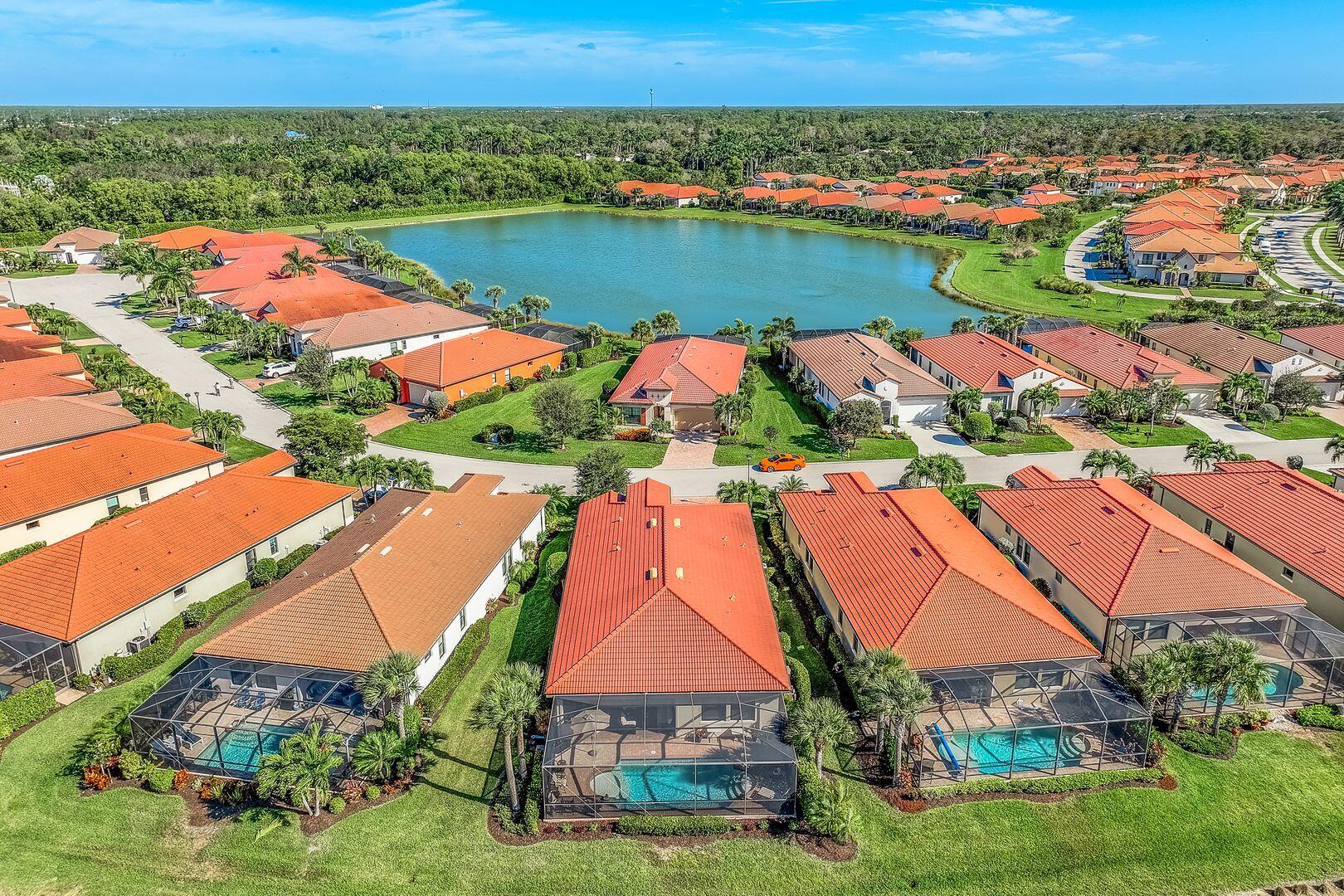 1433 Redona Way Naples, FL 34113 - Photo 20 of 50 an aerial view of residential houses with outdoor space and lake view