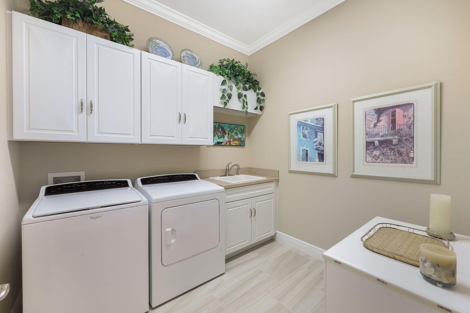 1433 Redona Way Naples, FL 34113 - Photo 28 of 50 a utility room with dryer and washer
