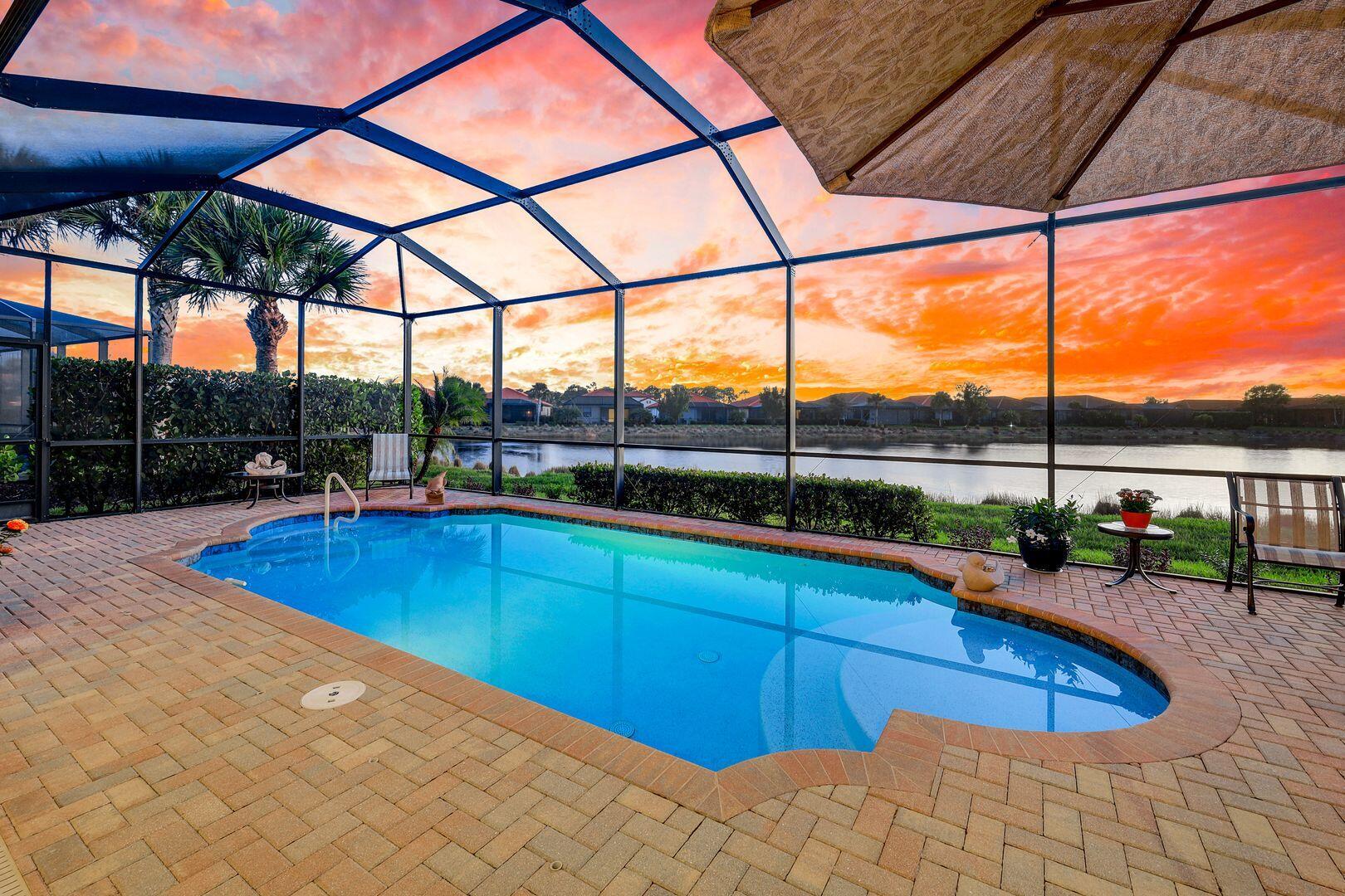 1433 Redona Way Naples, FL 34113 - Photo 3 of 50 a view of a swimming pool with a porch