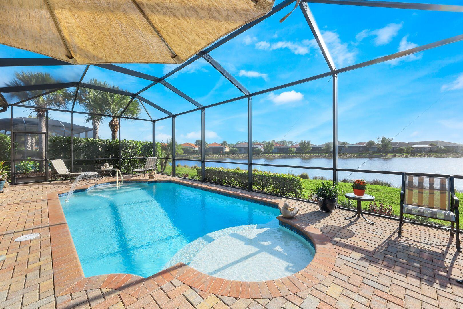 1433 Redona Way Naples, FL 34113 - Photo 34 of 50 a view of a swimming pool with a patio