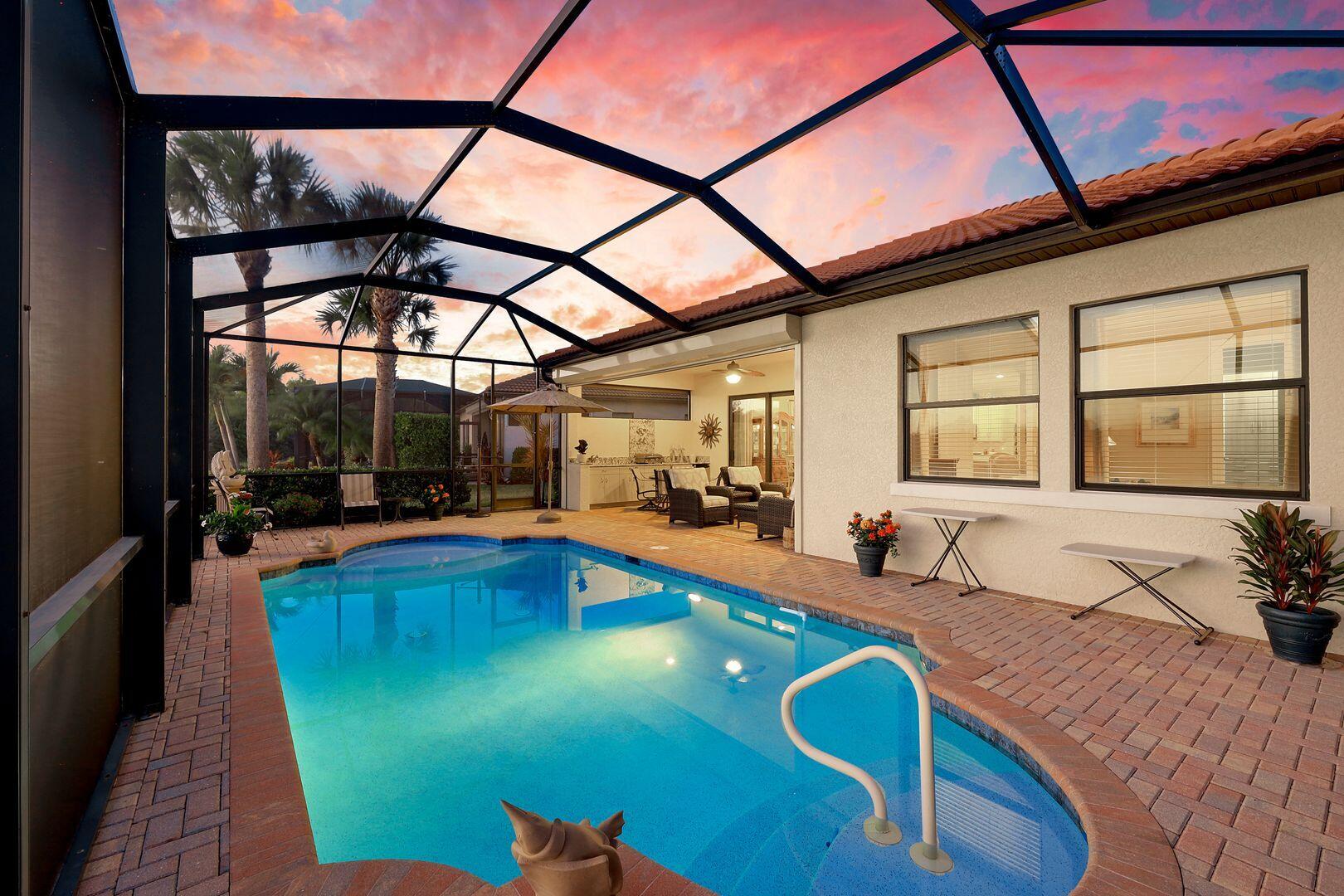 1433 Redona Way Naples, FL 34113 - Photo 40 of 50 a view of a swimming pool with a patio