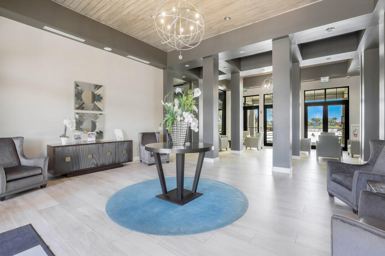 1433 Redona Way Naples, FL 34113 - Photo 43 of 50 a living room with furniture a chandelier and a dining room