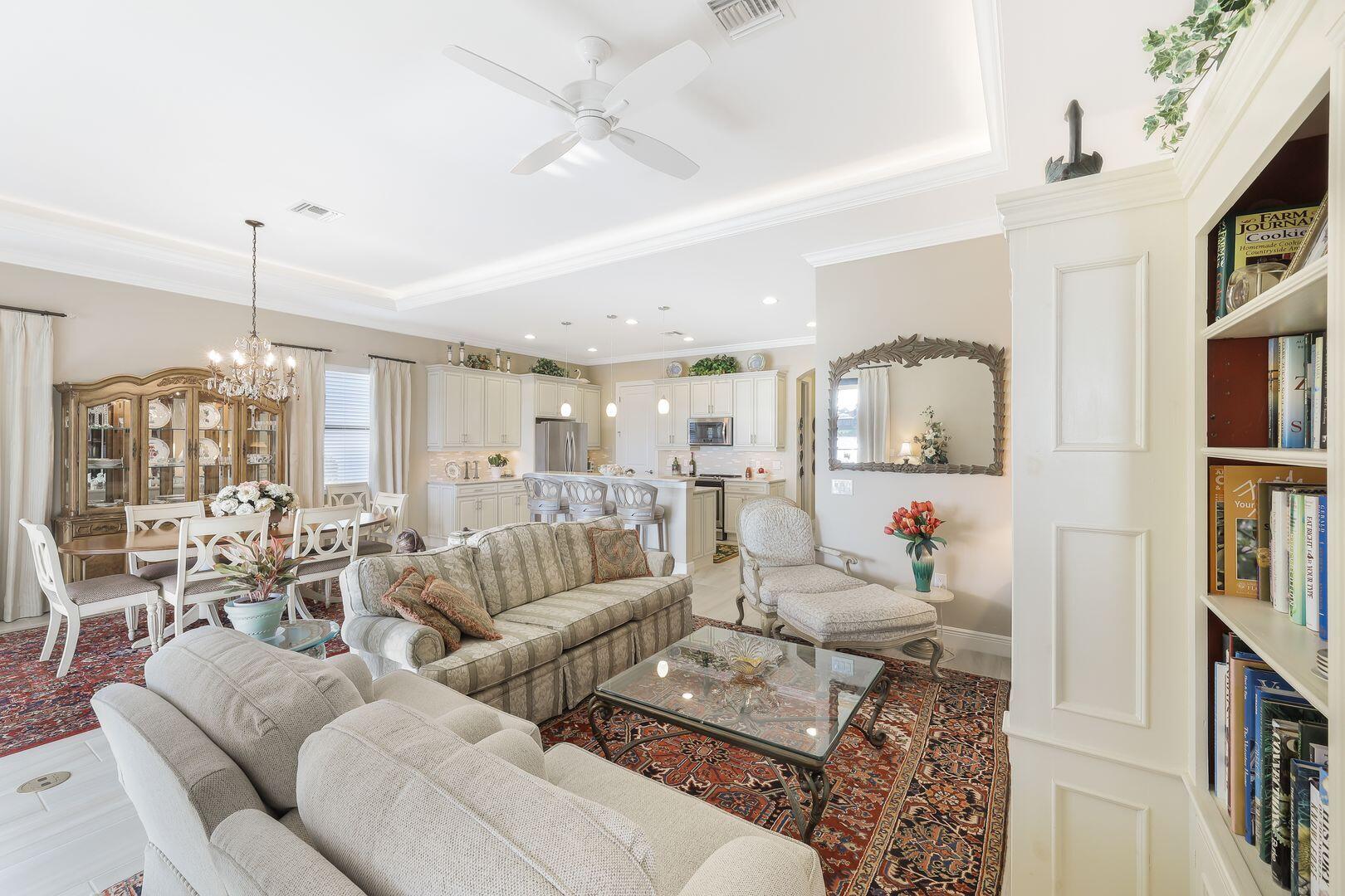 1433 Redona Way Naples, FL 34113 - Photo 6 of 50 a living room with furniture and a chandelier