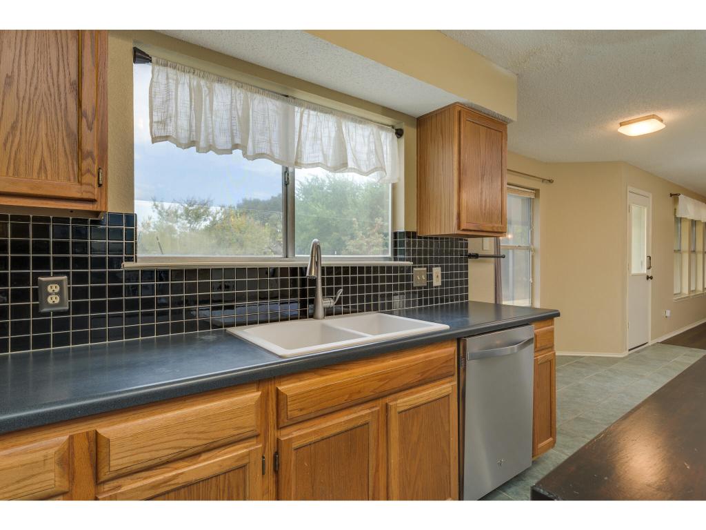 3912 Lemos Drive Austin, TX 78728 - Photo 13 of 40 a kitchen with a sink and large window
