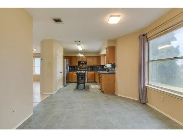 a view of a kitchen with furniture and a kitchen
