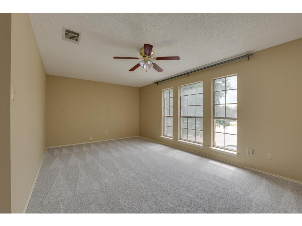 3912 Lemos Drive Austin, TX 78728 - Photo 22 of 40 a view of a livingroom with a ceiling fan and window